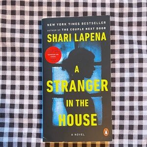 A Stranger in the House by Shari Lapena - Black and Yellow Cover